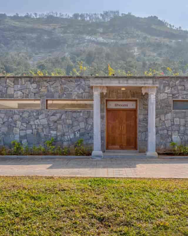 Sleek stone entrance of Aangan event space, perfect for corporate meetings and social events.