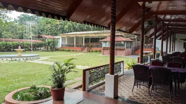 Darbar Hall at Jayamahal Palace: scenic outdoor venue for events with lush lawn seating.