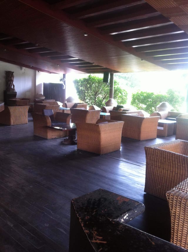 Gallops Restaurant event space with woven furniture, ideal for casual meetings and networking.