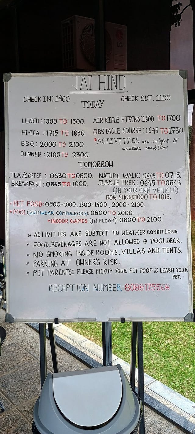 Cottage Rooms at VAMA Retreats with event schedule board for group retreat activities