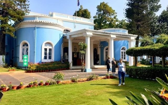 Garden Grove Bangalore Club: elegant venue with blue façade for meetings and events.