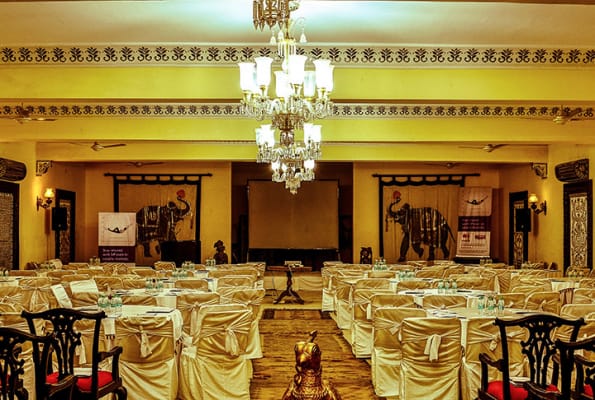 Elegant conference hall with ambient lighting for corporate events and celebrations.