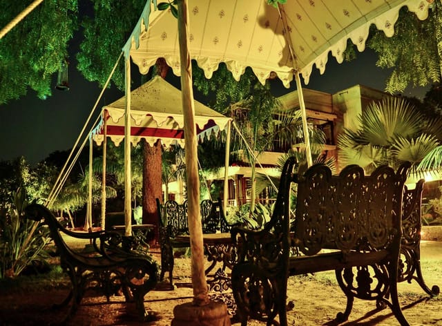 Elegant outdoor banquet hall with vintage seating for weddings and corporate events.
