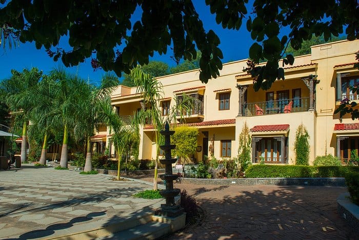 Outdoor event space at The Royal Retreat Resort & Spa with vibrant landscaping.