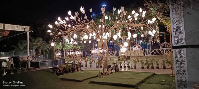 Thee Crystal Palace Banquet Hall with illuminated floral design for elegant weddings.