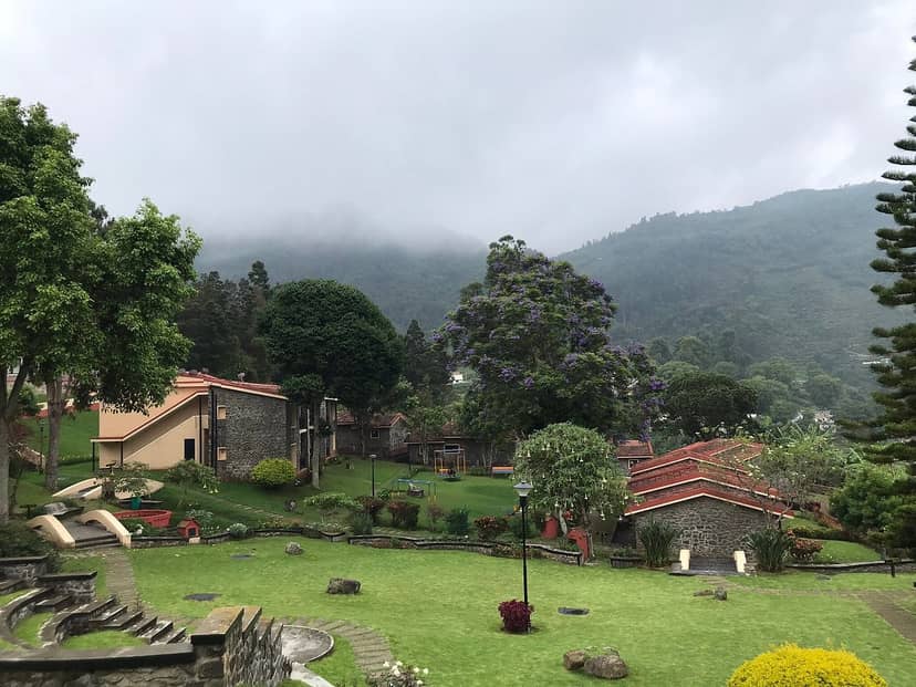 Outdoor Conference Hall in Kodaikanal, lush greenery for retreats and team-building events.