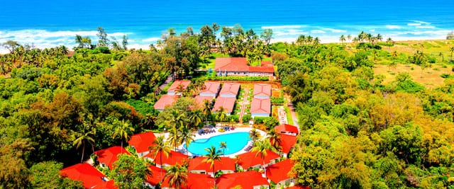 Large lawn at The Windflower Resort & Spa, perfect for serene outdoor meetings and events.