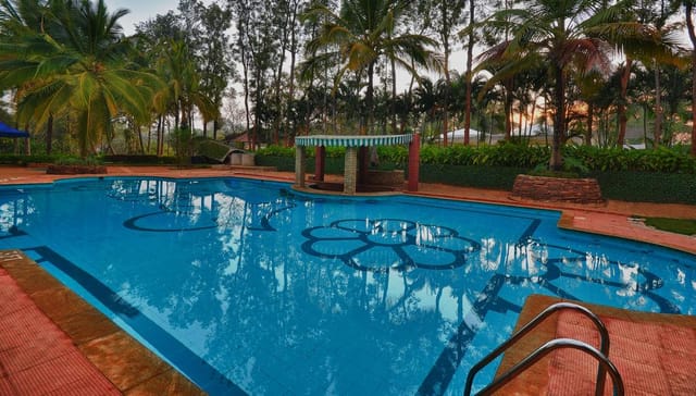Activity room at The Windflower Resort, pool area, ideal for corporate retreats and gatherings.