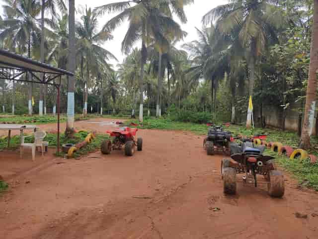 Quad bikes on dirt path at Windflower Resort, perfect for team-building retreats and adventures.