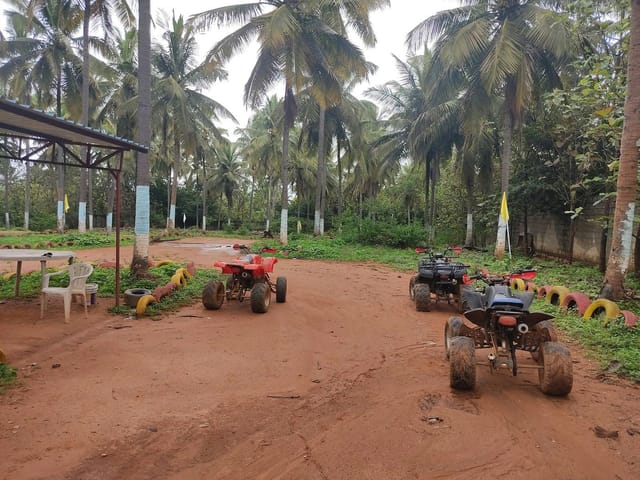 Quad bikes on dirt path at Windflower Resort, perfect for team-building retreats and adventures.