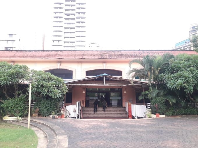 "Spacious fitness center venue for events, featuring modern architecture and greenery."