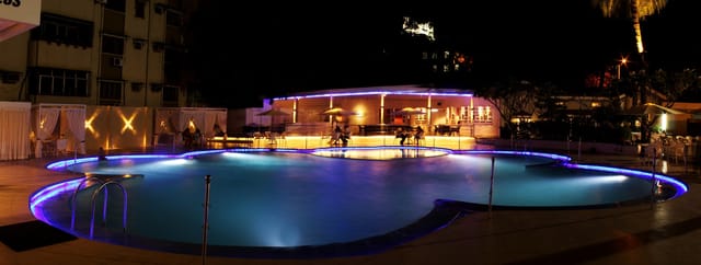 Poolside fitness venue with ambient lighting for cocktail receptions and social gatherings.