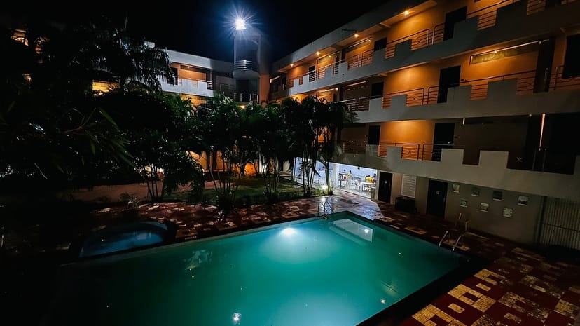Outdoor hotel pool at Sterling Yelagiri, perfect for evening events and gatherings.