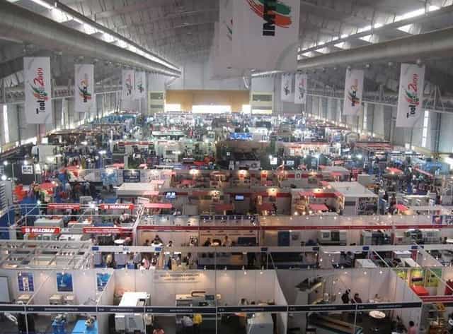 Bangalore Exhibition Centre Hall 3A: bustling trade show venue with vibrant displays.