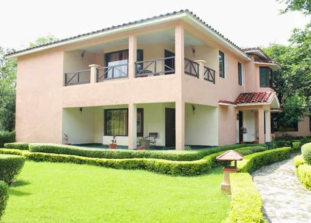 Kosi Court venue with lush garden, ideal for outdoor events and workshops in Corbett.
