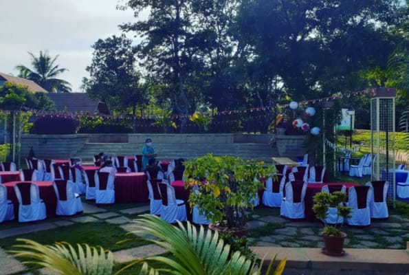 Mehndi function at Club Cabana with elegant red and white table setup, perfect for events.