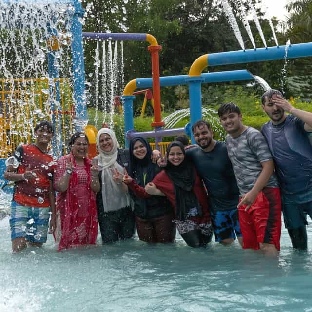 Vibrant outdoor team-building event at Club Cabana with water activities.