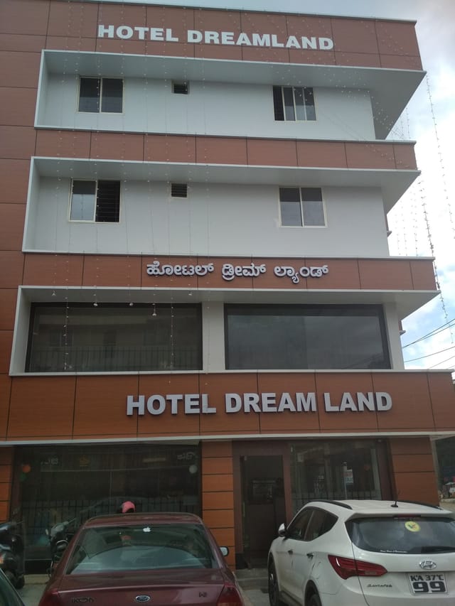 Hotel Dream Land façade, modern design ideal for corporate retreats and gatherings.