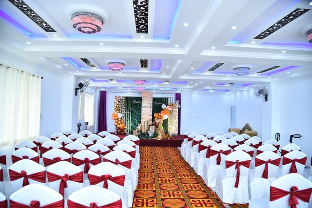 Conference Hall in Cospolitan Club, elegantly draped chairs, perfect for conferences and celebrations.
