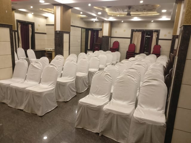 Mini Party Hall at Cospolitan Club, elegant chair covers for meetings and conferences.