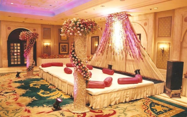 Elegant banquet hall with floral decor, perfect for weddings and upscale events.