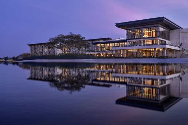 Modern conference room with glass facade at JW Marriott Bengaluru for upscale meetings.