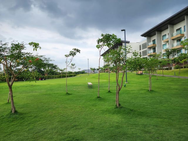 JW Marriott Bengaluru meeting room with lush lawn, ideal for outdoor events and gatherings.
