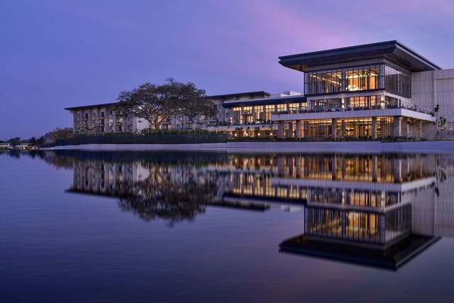 Conference Room in JW Marriott Bengaluru with large windows, perfect for corporate events.