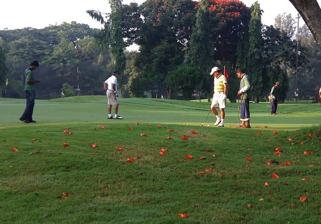 Serene Bangalore Golf Club course with lush greens, ideal for corporate outings and team-building.