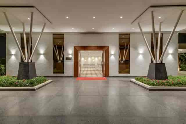 Modern entrance with red carpet at Aurea, Ramada Bengaluru for upscale events and receptions.