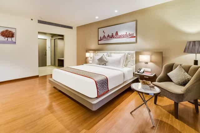 Modern hotel room in Ramada Bengaluru Yelahanka, ideal for business retreats and comfort.