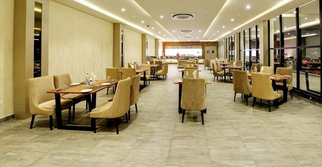Elegant dining area at B 64 Ramada Bengaluru Yelahanka for events and meetings.