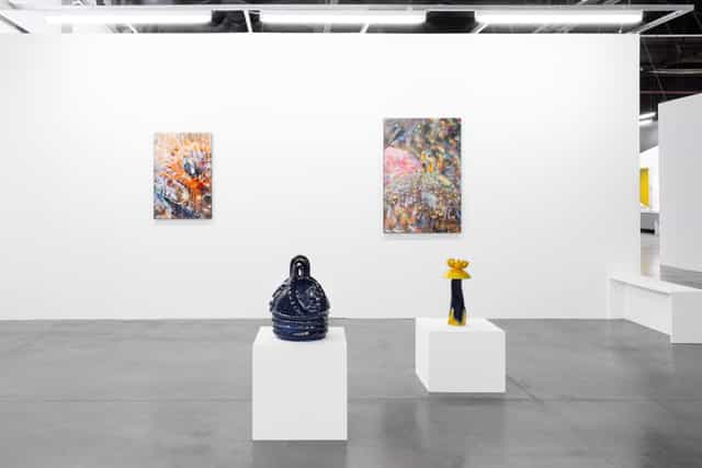 Modern art gallery with white pedestals for upscale events and exhibitions.