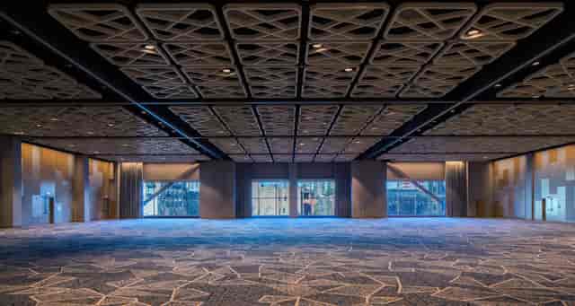 Grand Horizon Ballroom, modern venue with patterned ceiling, ideal for conferences and corporate events.