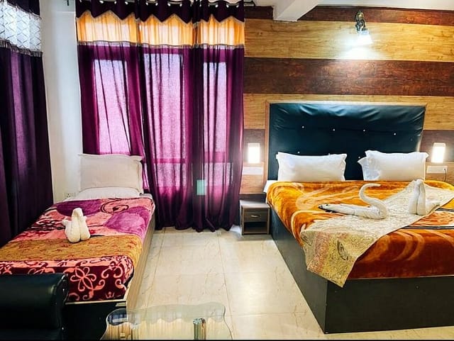 Classic Suite at Triden Kashmir Resort with cozy bedding, ideal for events and meetings.