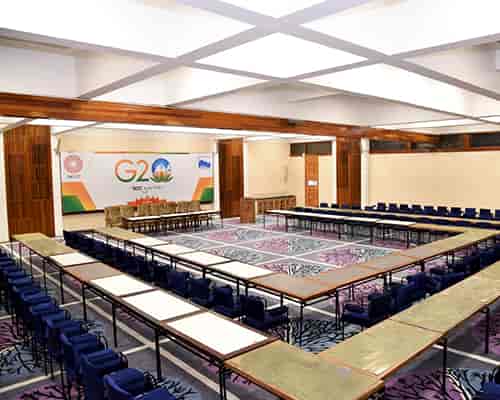 G20 conference hall in Kashmir with tables set for networking and collaboration.