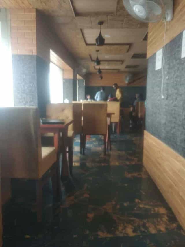 Cozy restaurant meeting space with wooden furnishings at 11 Boulevard Hotel