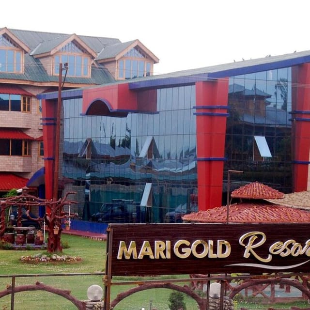 Modern event venue at The Marigold Resort with glass facade for corporate meetings.