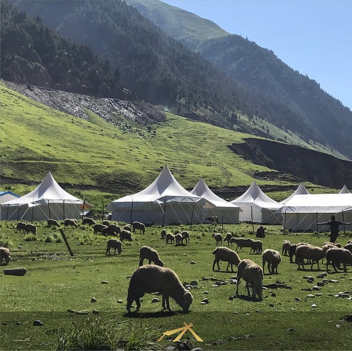Outdoor event setup with white tents in Sheen Woods Resort, perfect for weddings and retreats.
