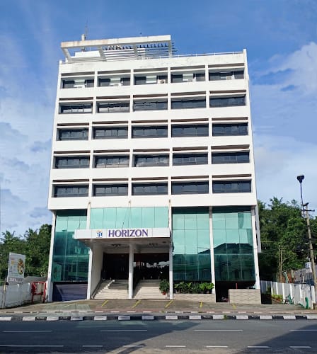 Modern multi-story event venue with large glass facade at Hotel Horizon.
