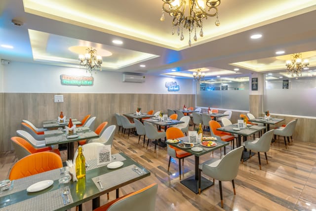 Modern banquet hall with elegant chandeliers, perfect for networking lunches and intimate events.