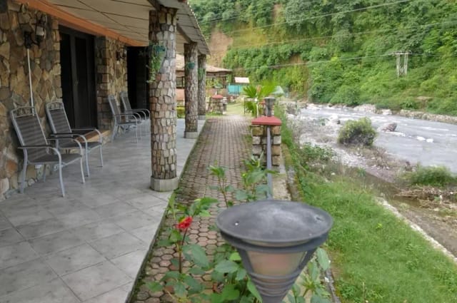 Cottages in Chardham Hotel, stone architecture, serene outdoor event venue