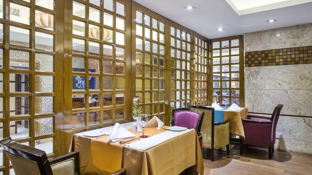 Intimate dining area in Hotel Bengal Blueberry, perfect for corporate gatherings or celebrations.
