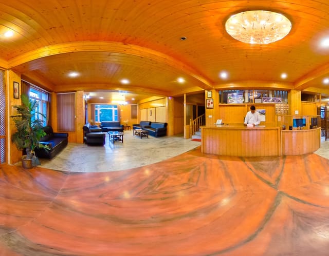 Welcoming hotel lobby with wooden accents, ideal for conferences and networking events.