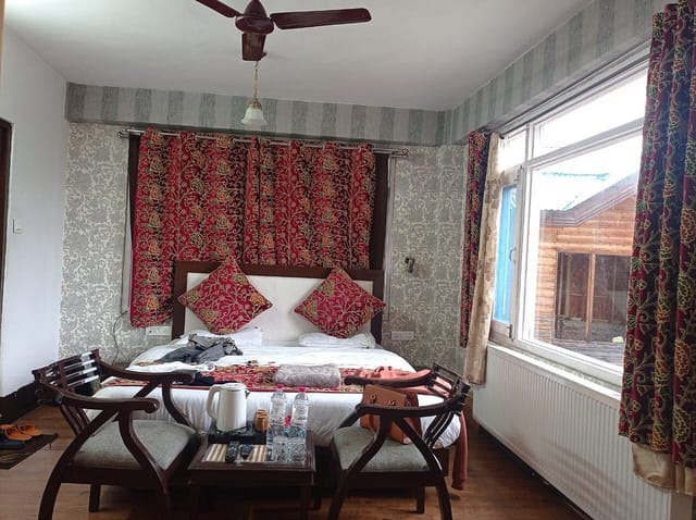 Cozy Hotel Signature suite with floral decor for team retreats and meetings.