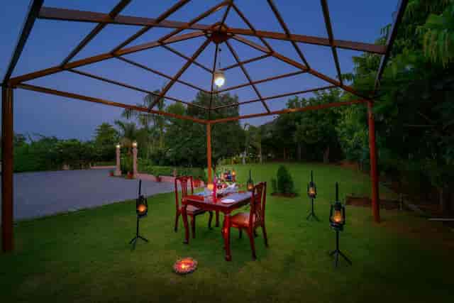 Outdoor dining setup in gazebo at WelcomHeritage Mount Valley Resort for special events.