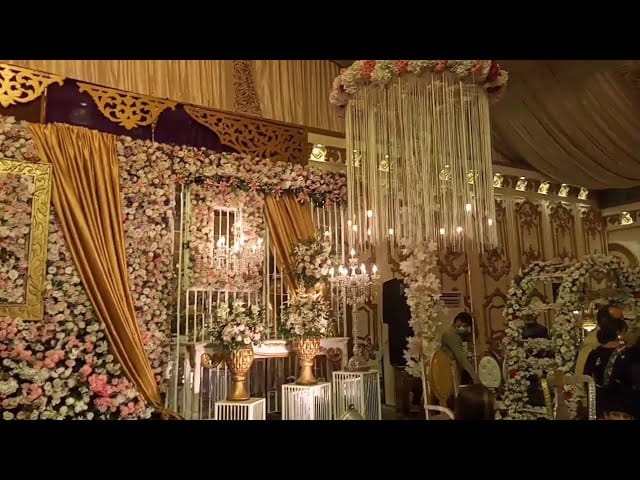 Grand Ballroom in Dera Marriage Hall, adorned with floral decor for elegant weddings.