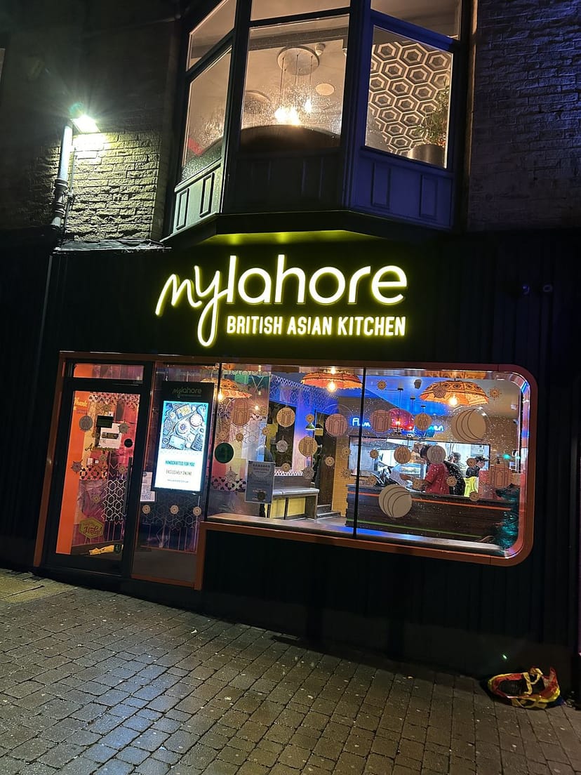 Vibrant MyLahore restaurant with neon signage for casual dining events