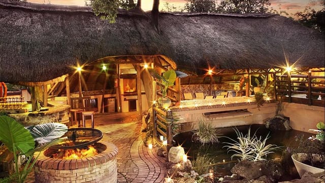 Outdoor venue Lodge in Thatch Chapel with rustic thatched roof for intimate events.