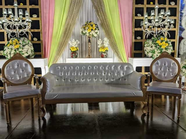 Elegant event seating area in Bukhara Royale with plush sofas for formal celebrations.